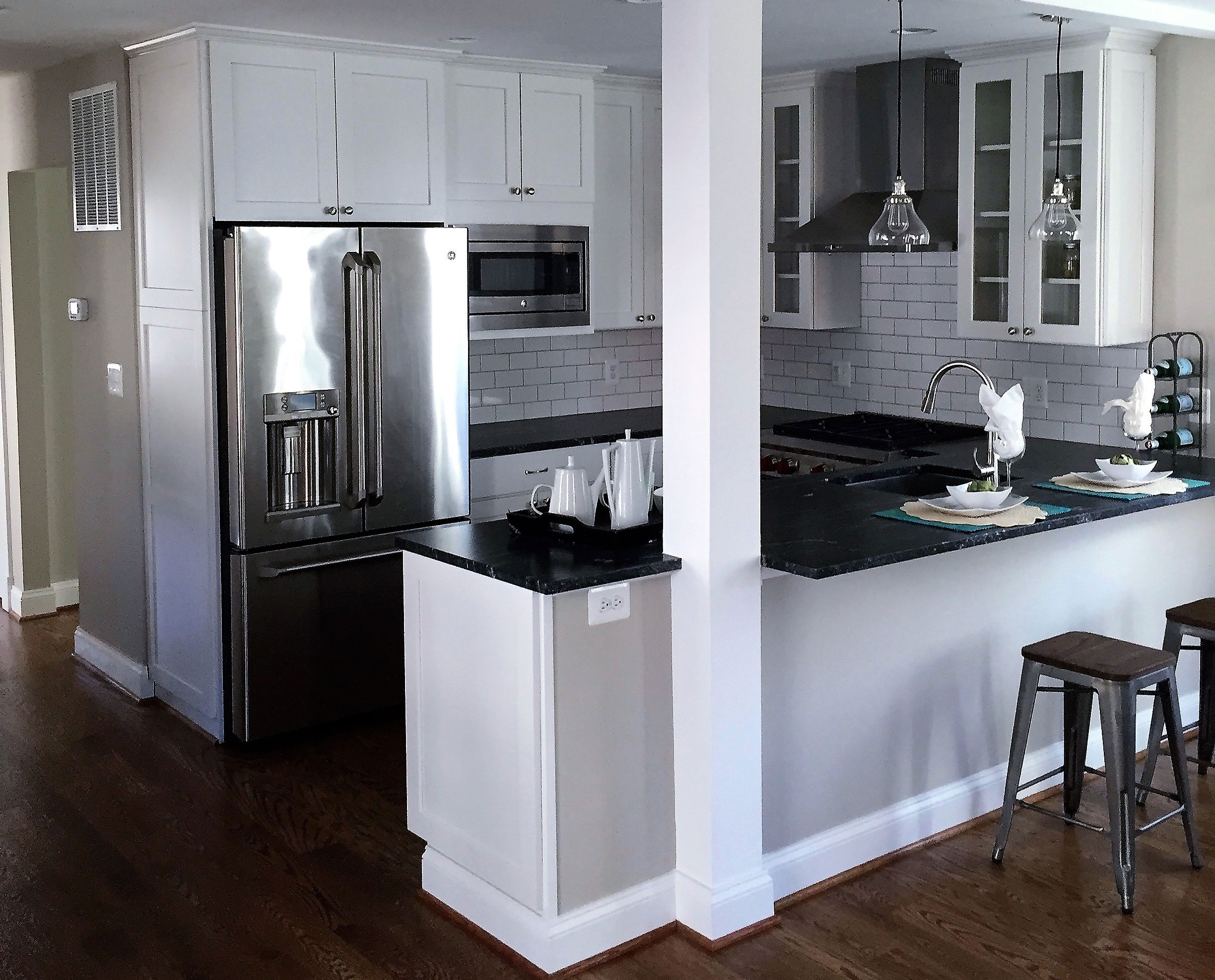Two metal bar stools at countertop